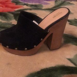 Black leather wooden clogs